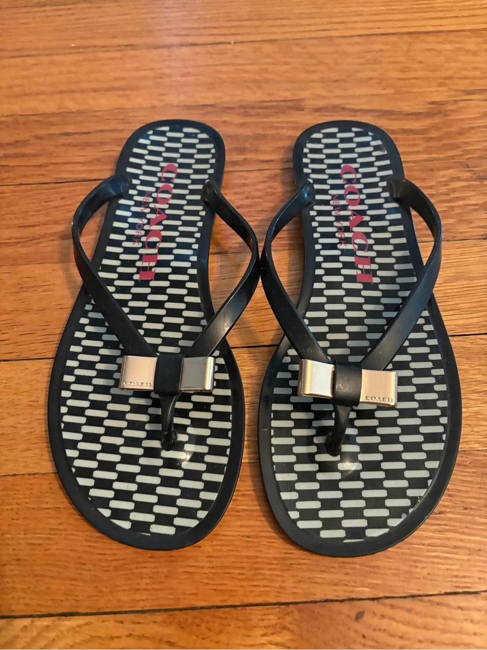 Coach Black Jelly Flip Flops with Gold Bow and Patterned Footbed sz 6